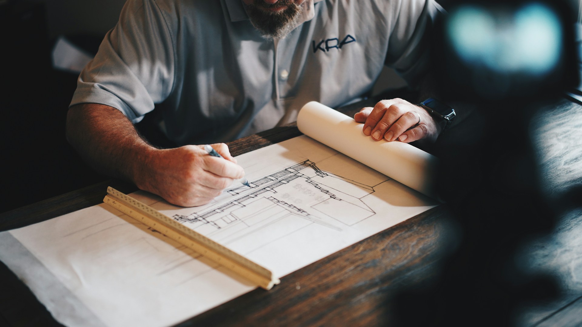 Tradesman working on Blueprint Drawing